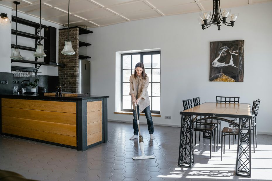 restaurant worker using professional floor cleaning equipment to clean the floors